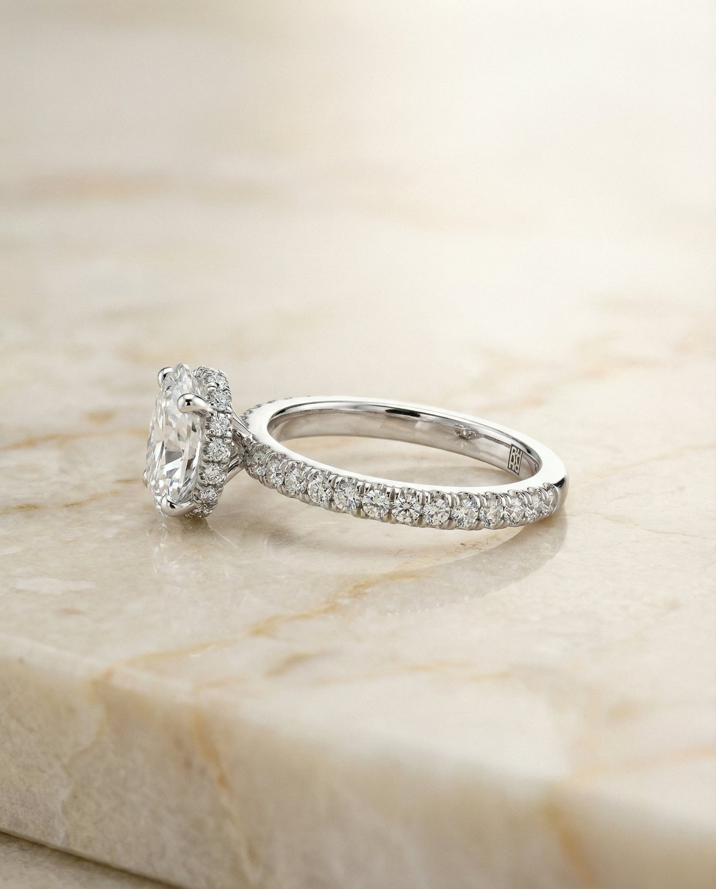 Secret Halo French Pavé Solitaire Oval, in Platinum – side profile | RockHer