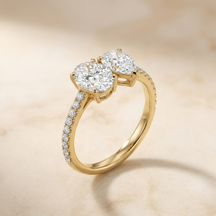 14K Yellow Gold Selena Select Toi et Moi Oval & Pear Pavé Band Lab Diamond Engagement Ring - Alt angle on warm marble