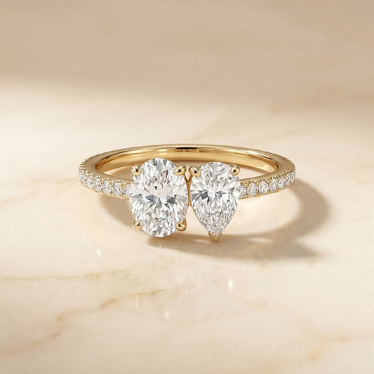 14K Yellow Gold Selena Select Toi et Moi Oval & Pear Pavé Band Lab Diamond Engagement Ring - Hero on warm marble
