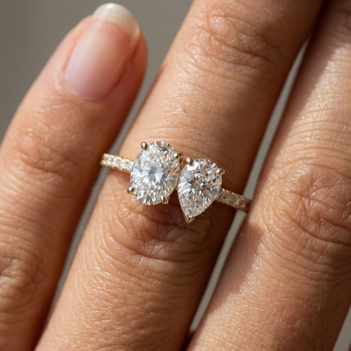 14K Yellow Gold Selena Select Toi et Moi Oval & Pear Pavé Band Lab Diamond Engagement Ring - Macro close-up on finger