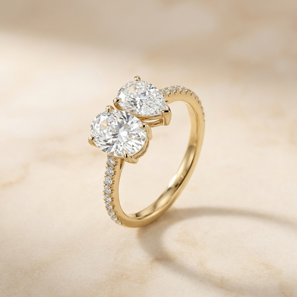 18K Yellow Gold Selena Select Toi et Moi Oval & Pear Pavé Band Lab Diamond Engagement Ring - Alt angle on warm marble