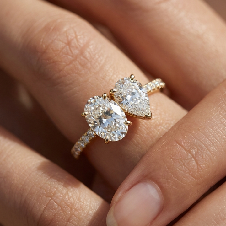 18K Yellow Gold Selena Select Toi et Moi Oval & Pear Pavé Band Lab Diamond Engagement Ring - Macro close-up on finger