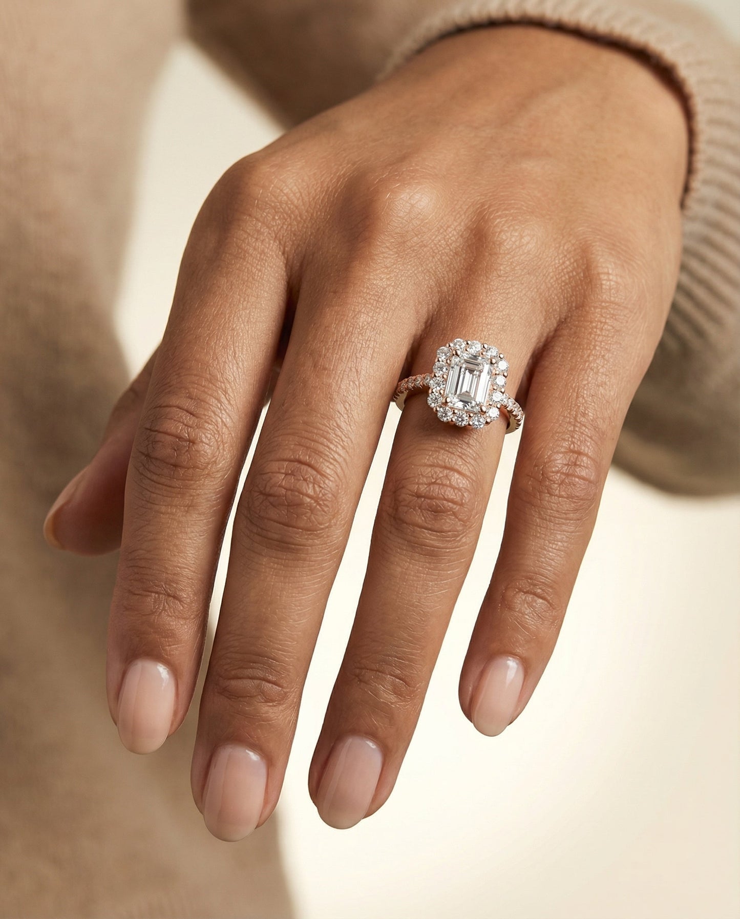 European Cut, Shared Prong Halo Emerald, in 14K Rose Gold – lifestyle shot | RockHer