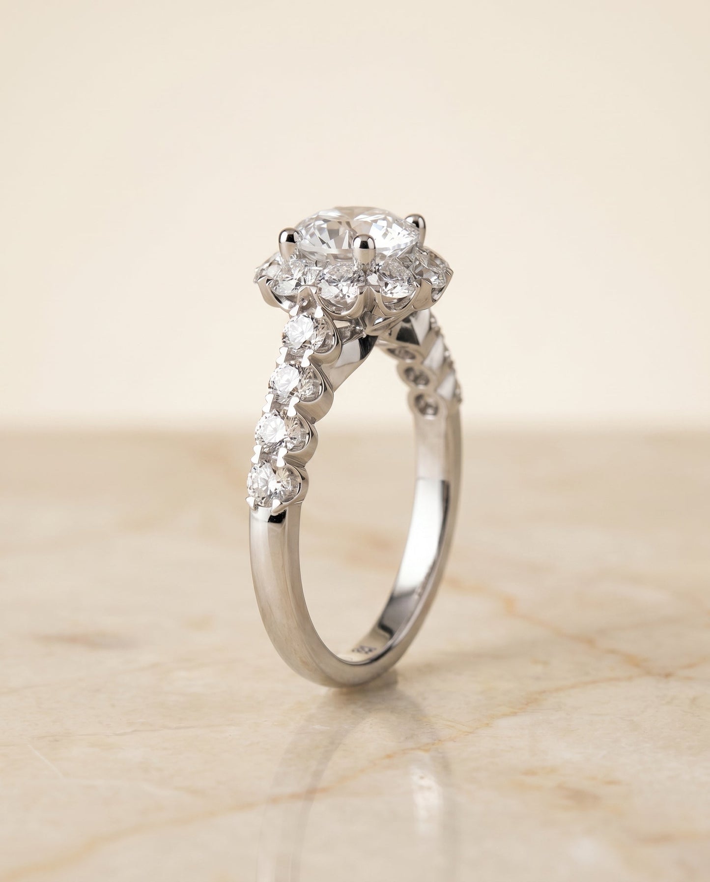 Round Brilliant, Shared Prong Halo Linear Band, in 18K White Gold – angled view | RockHer
