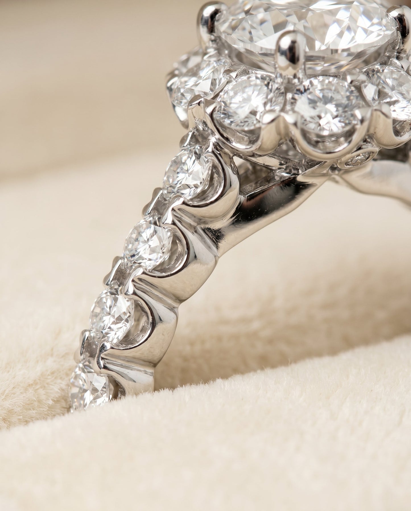 Round Brilliant, Shared Prong Halo Linear Band, in 18K White Gold – detail view | RockHer