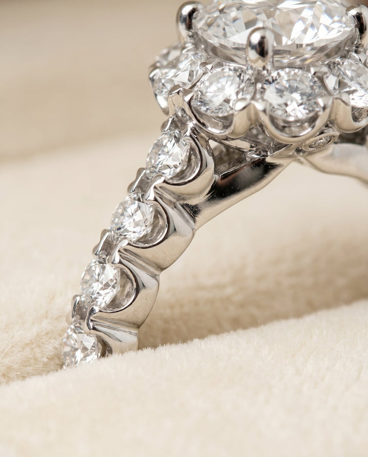 Round Brilliant, Shared Prong Halo Linear Band, in 18K White Gold – detail view | RockHer