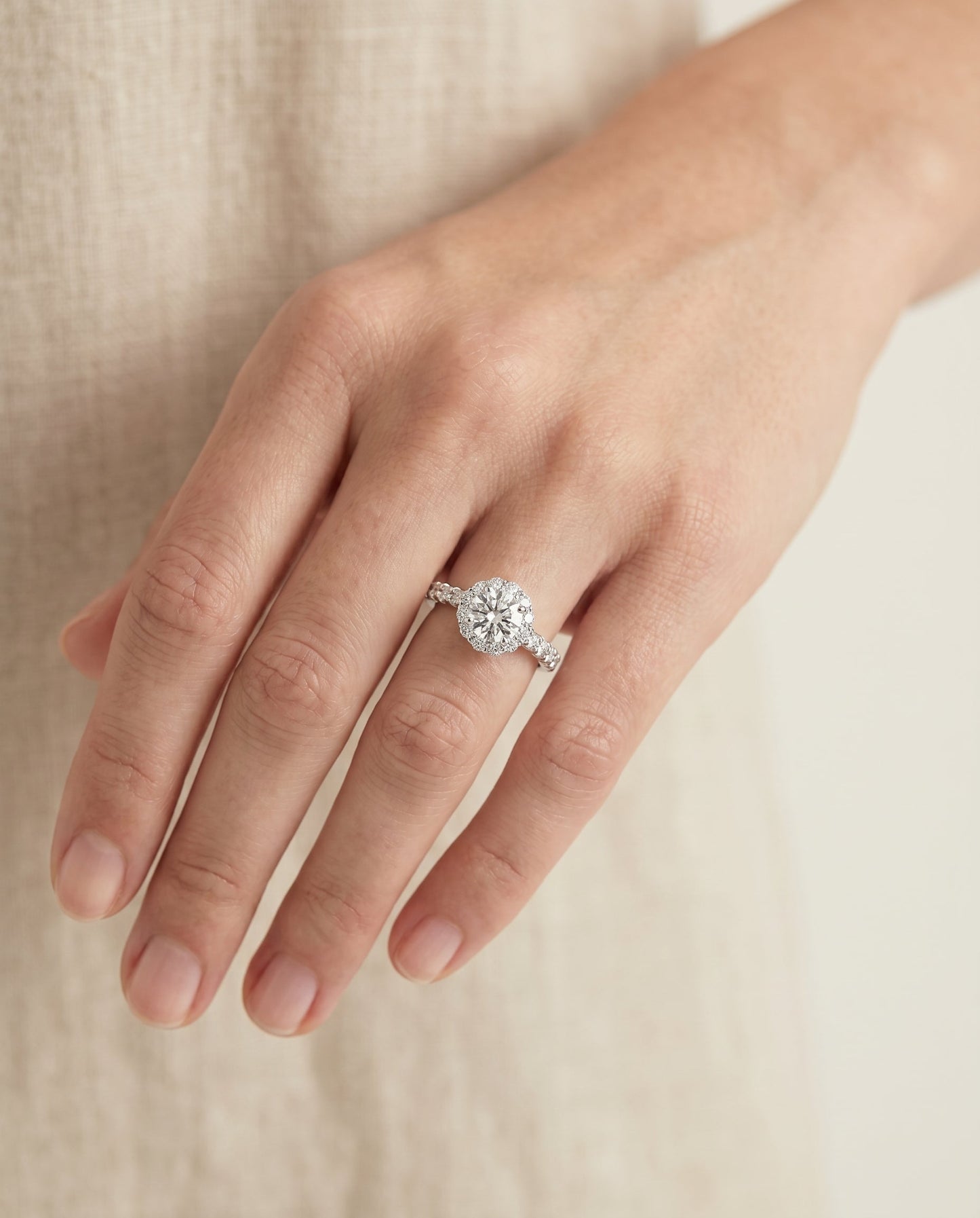 Round Brilliant, Shared Prong Halo Linear Band, in 18K White Gold – lifestyle shot | RockHer