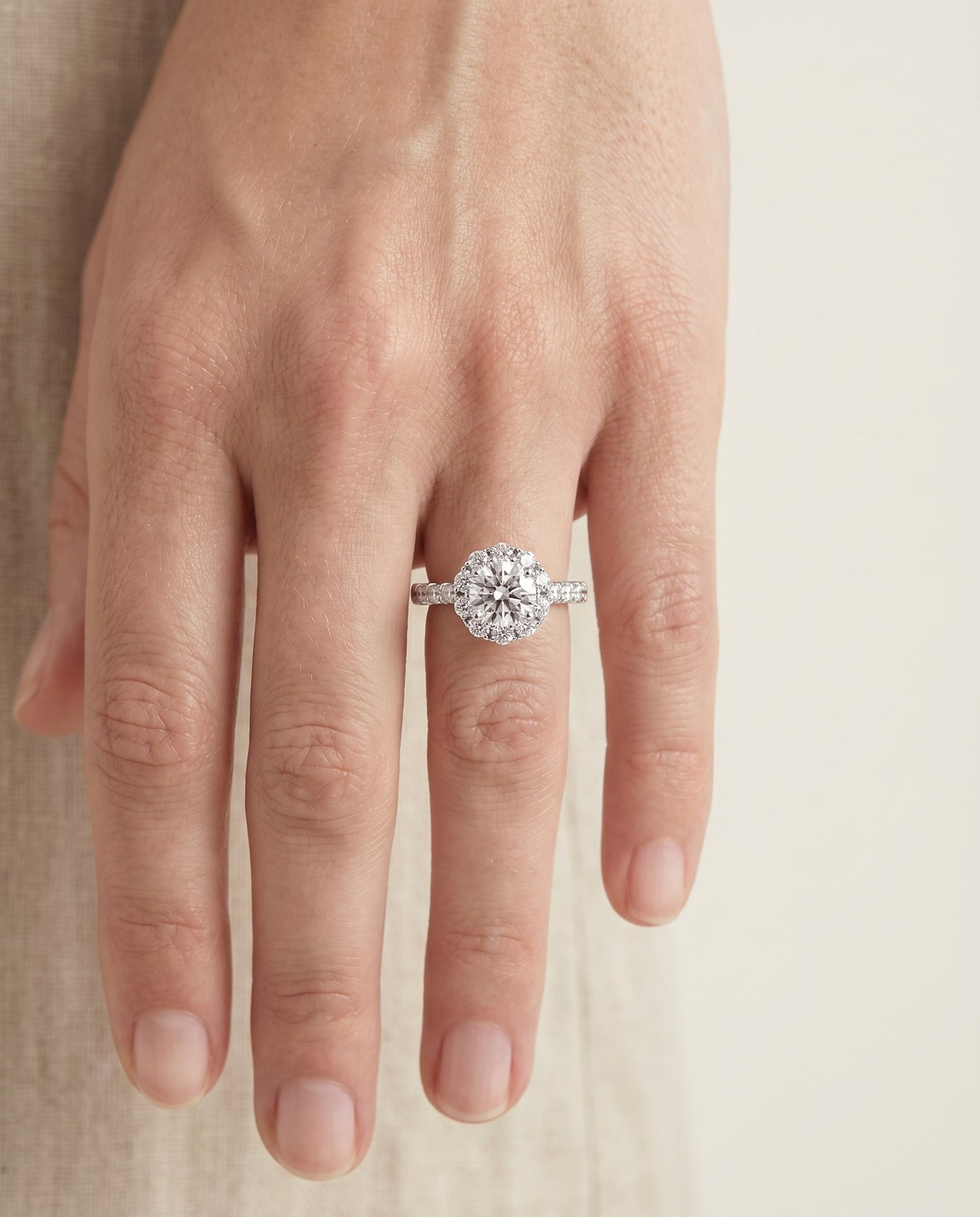 Round Brilliant, Shared Prong Halo Linear Band, in 18K White Gold – lifestyle shot | RockHer