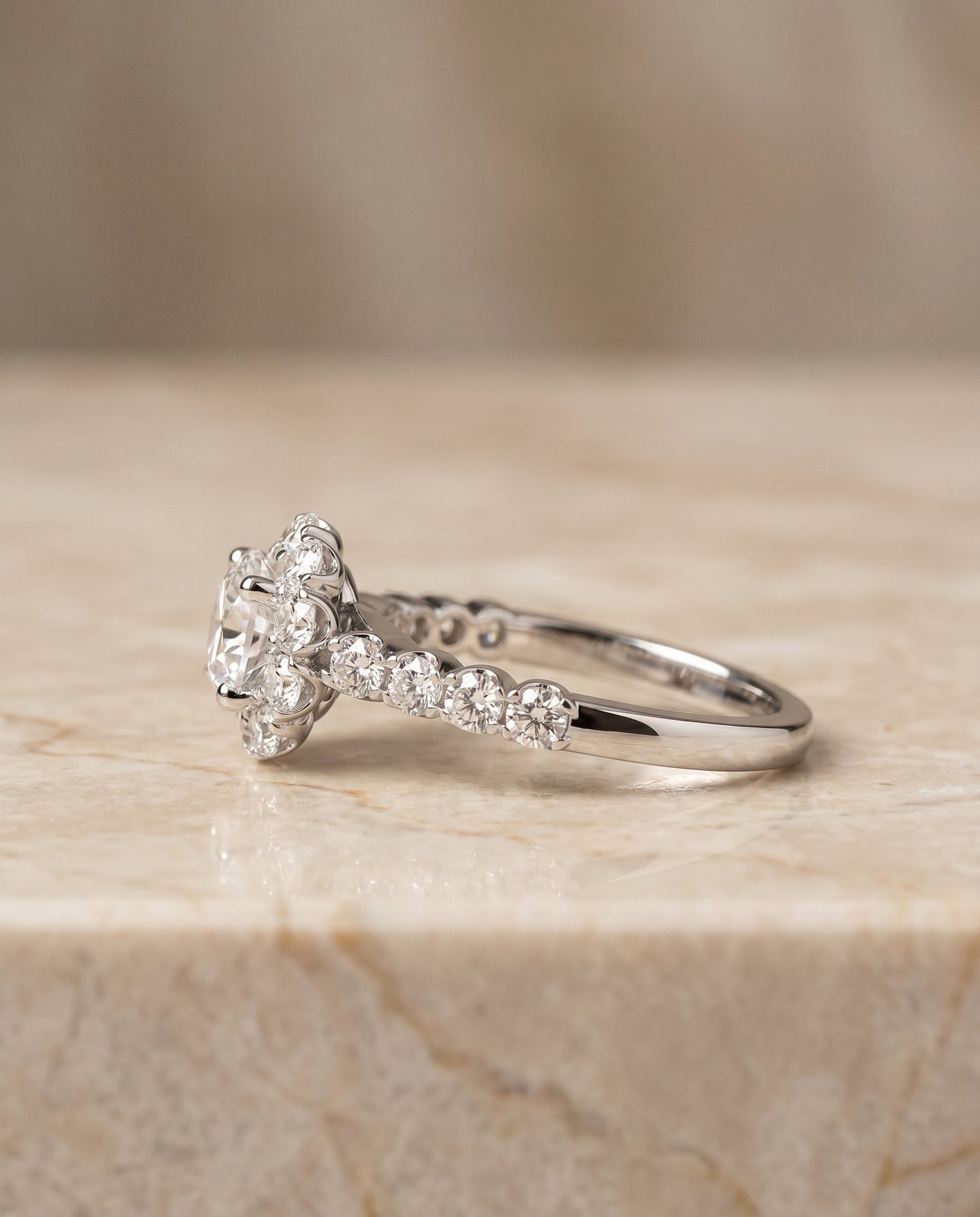 Round Brilliant, Shared Prong Halo Linear Band, in 18K White Gold – side profile | RockHer