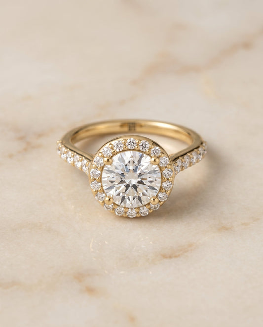 Round Brilliant, Shared Prong Halo Round, in 18K Yellow Gold, pave setting – angled view | RockHer