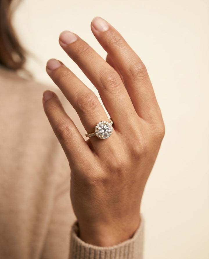 Round Brilliant, Shared Prong Halo Round, in 18K Yellow Gold, pave setting – lifestyle shot | RockHer