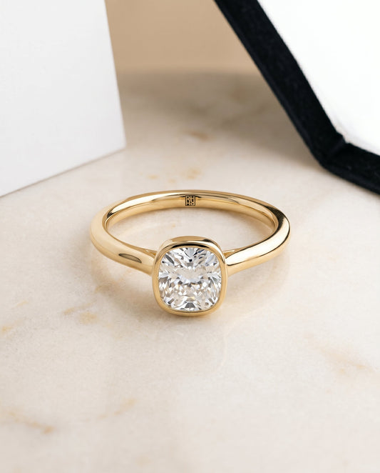The Duran Bezel Solitaire Engagement Ring Setting for Cushion Diamonds in 18K Yellow Gold | RockHer