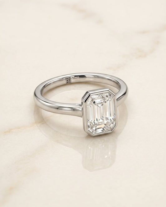The Duran Bezel Solitaire Engagement Ring Setting for Emerald Cut Diamonds in Platinum | RockHer