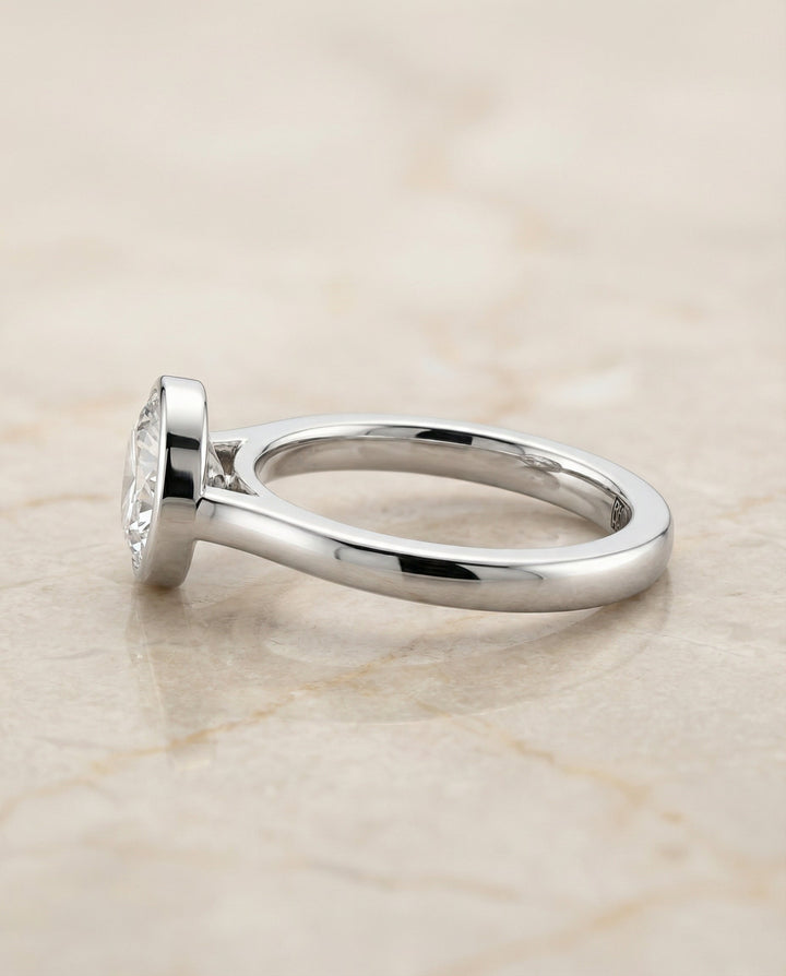 Round Brilliant, Simple Bezel Solitaire, in Platinum – side profile | RockHer