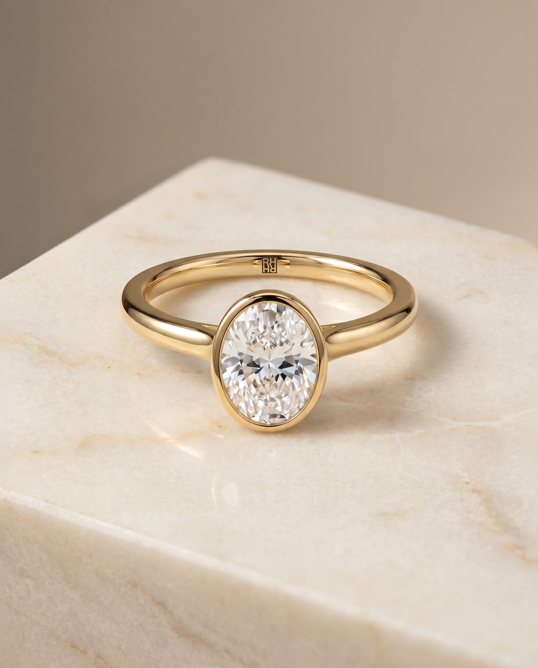 The Duran Bezel Solitaire Engagement Ring Setting for Oval Diamonds in 18K Yellow Gold | RockHer