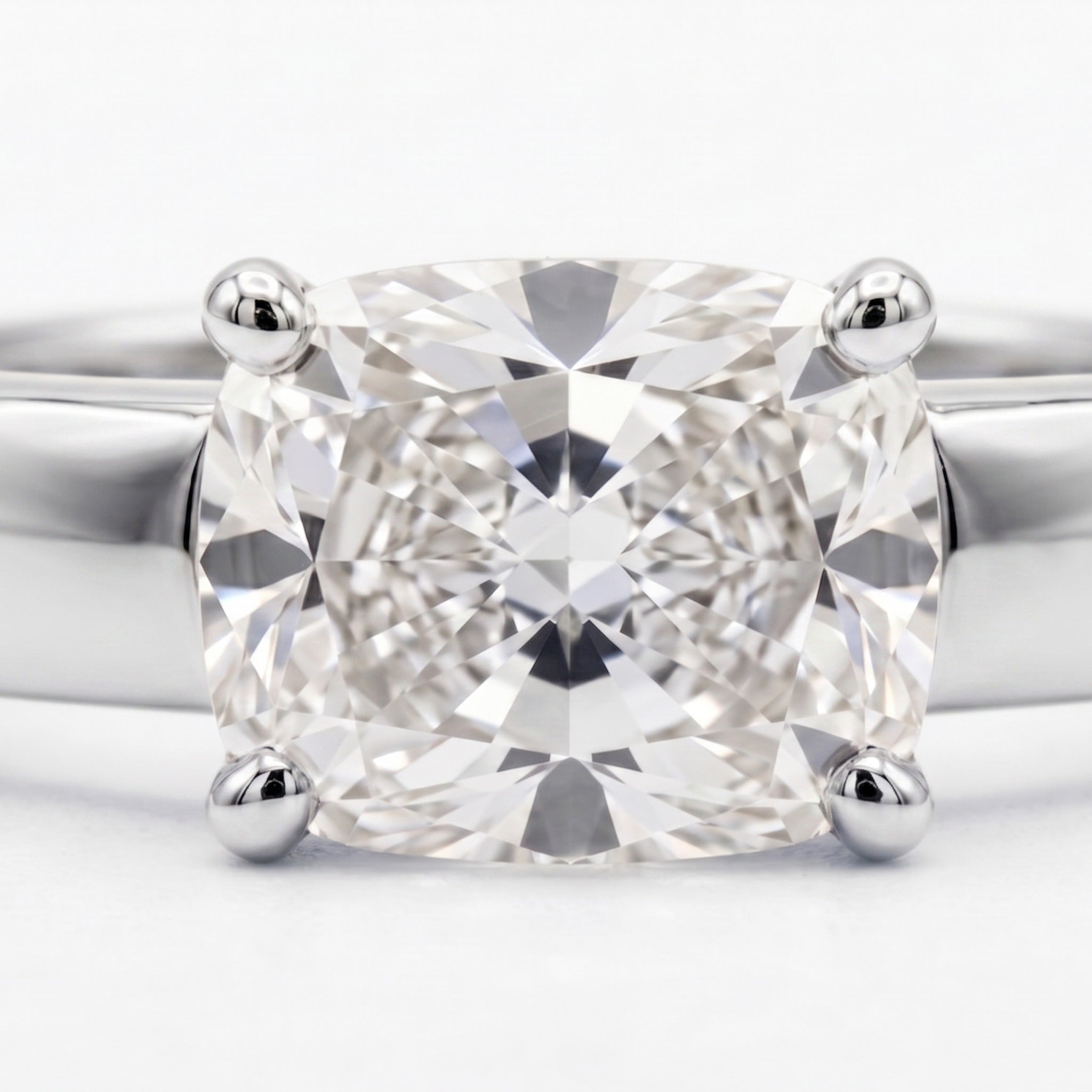 Cushion Bold Band Solitaire, in Platinum, prong setting – front view | RockHer