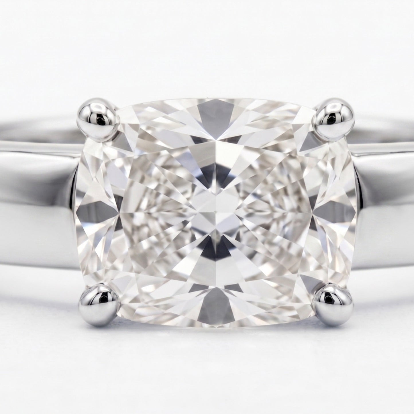 Cushion Bold Band Solitaire, in Platinum, prong setting – front view | RockHer