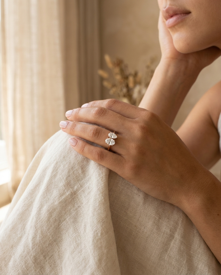 14K Rose Gold Solange Toi et Moi Select Oval & Pear Lab Diamond Engagement Ring - Lifestyle scene with hand model