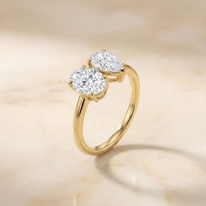 14K Yellow Gold Solange Toi et Moi Select Oval & Pear Lab Diamond Engagement Ring - Alt angle on warm marble