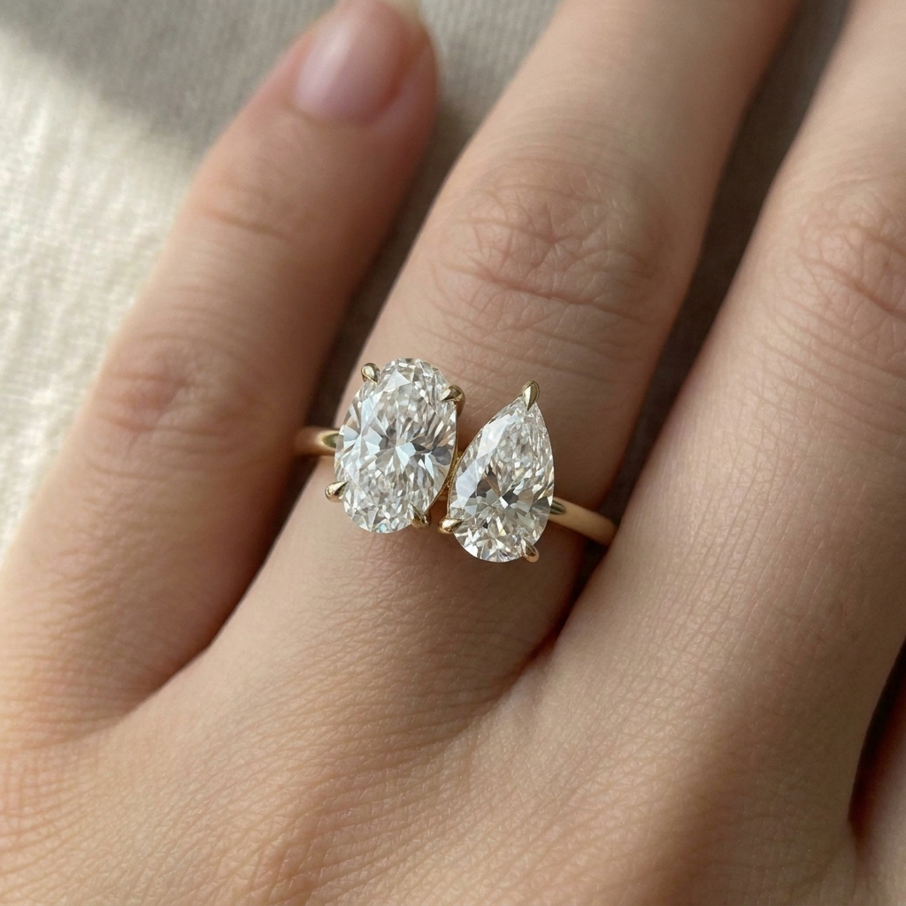 14K Yellow Gold Solange Toi et Moi Select Oval & Pear Lab Diamond Engagement Ring - Macro close-up on finger