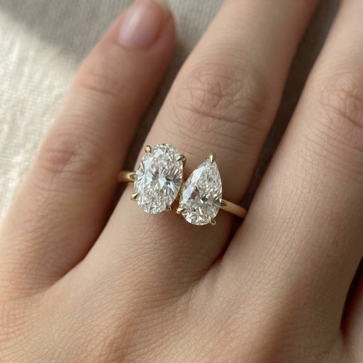 14K Yellow Gold Solange Toi et Moi Select Oval & Pear Lab Diamond Engagement Ring - Macro close-up on finger
