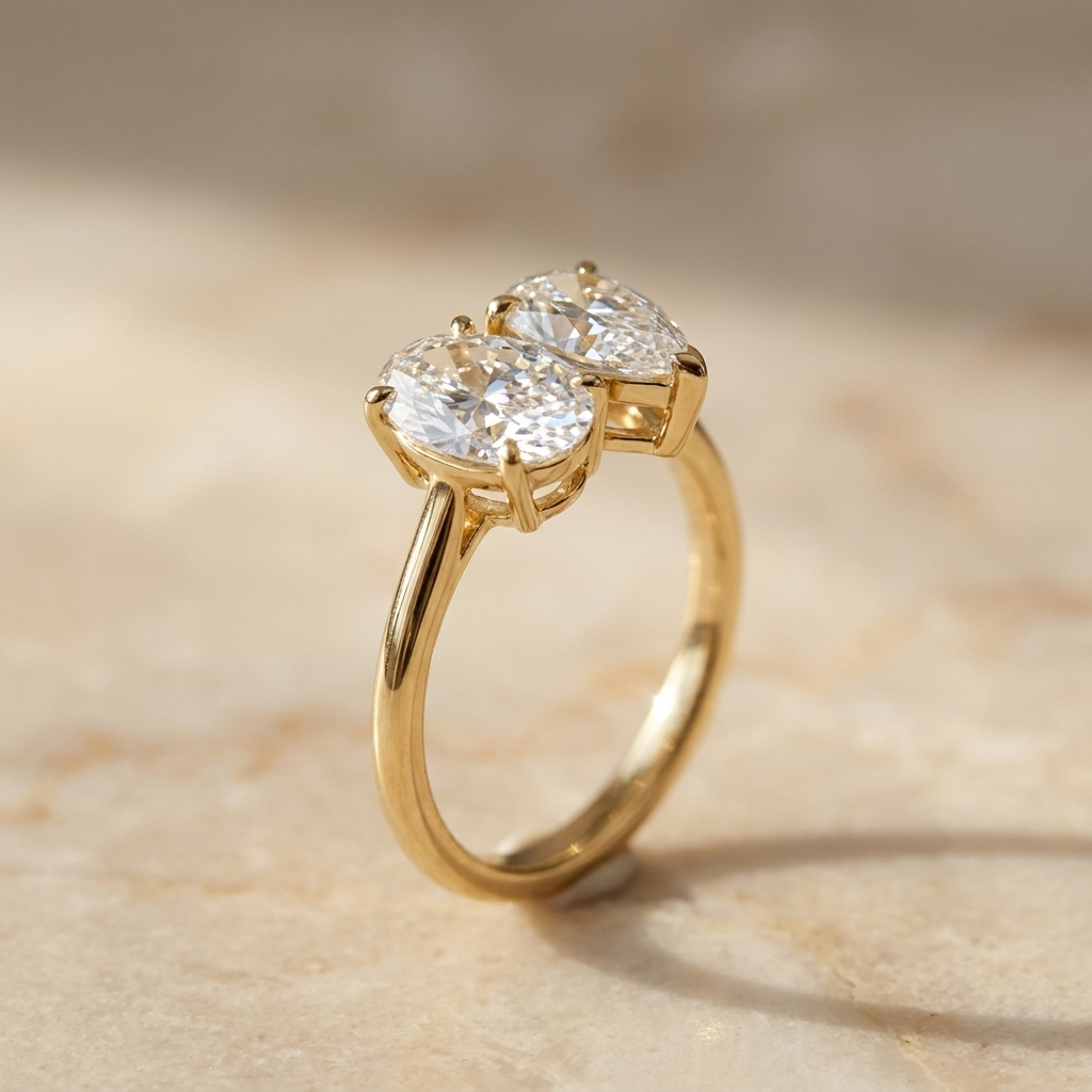 18K Yellow Gold Solange Toi et Moi Select Oval & Pear Lab Diamond Engagement Ring - Alt angle on warm marble