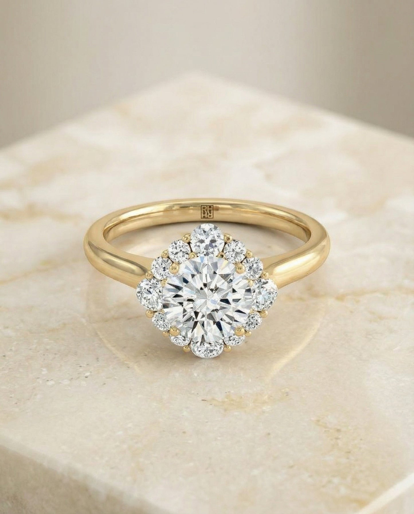 Round Brilliant, Square Halo Secret Stone, in 18K Yellow Gold, prong setting – angled view | RockHer