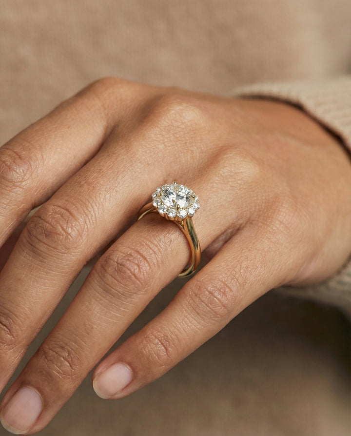 Round Brilliant, Square Halo Secret Stone, in 18K Yellow Gold, prong setting – lifestyle shot | RockHer