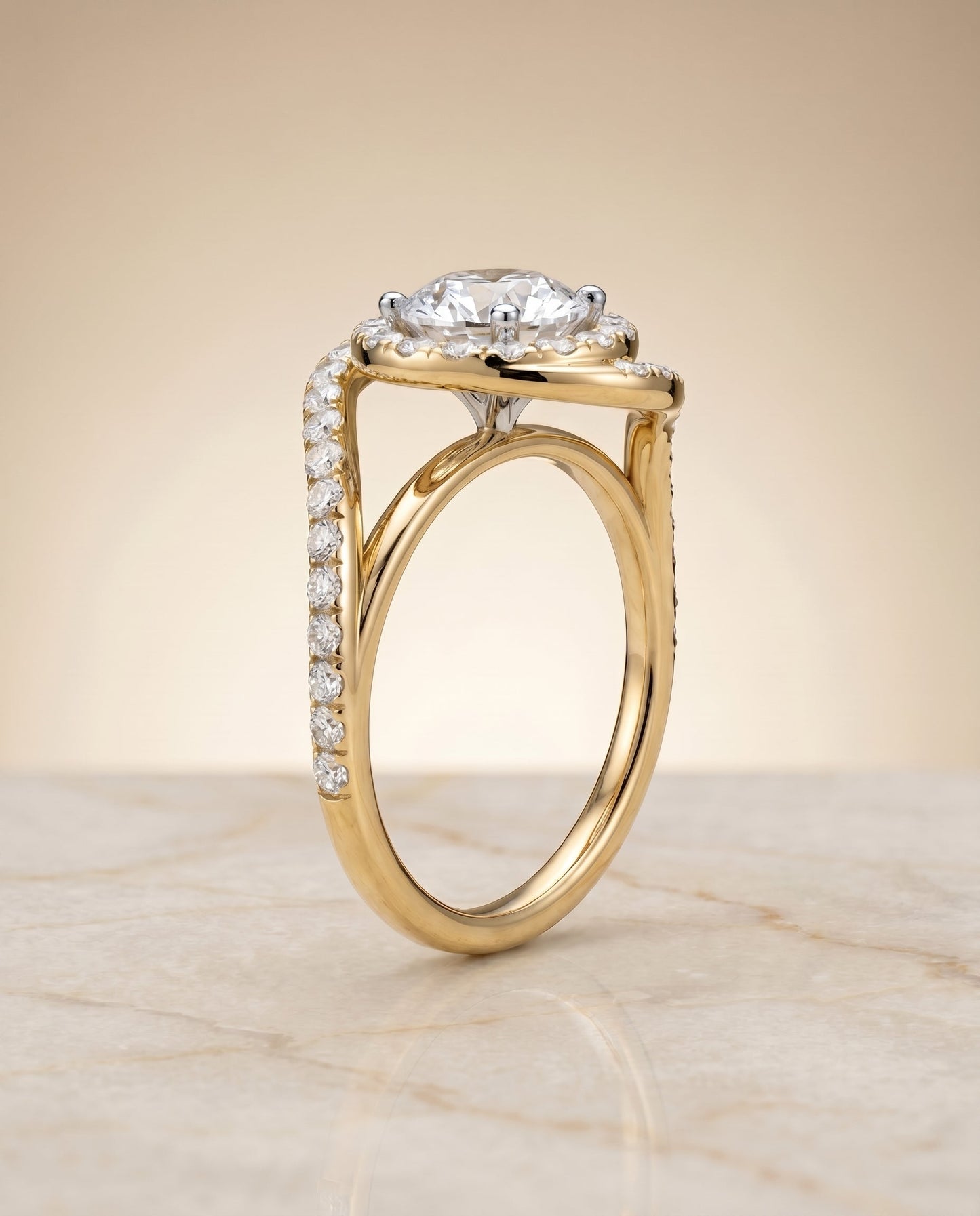 Round Brilliant, Swirl Twist Pavé Halo, in 18K Yellow Gold, pave setting – angled view | RockHer