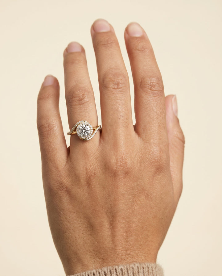 Round Brilliant, Swirl Twist Pavé Halo, in 18K Yellow Gold, pave setting – lifestyle shot | RockHer