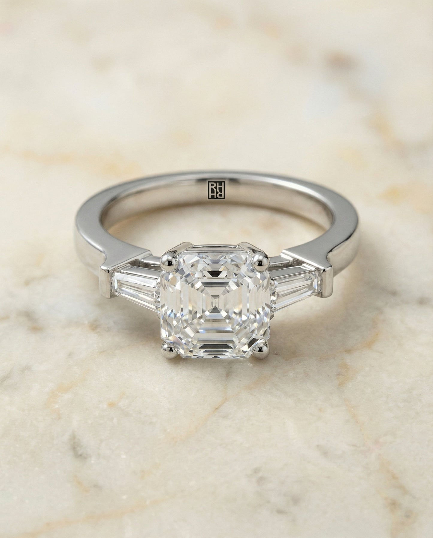 Tapered Baguette Three Stone Asscher, in Platinum, channel setting – angled view | RockHer