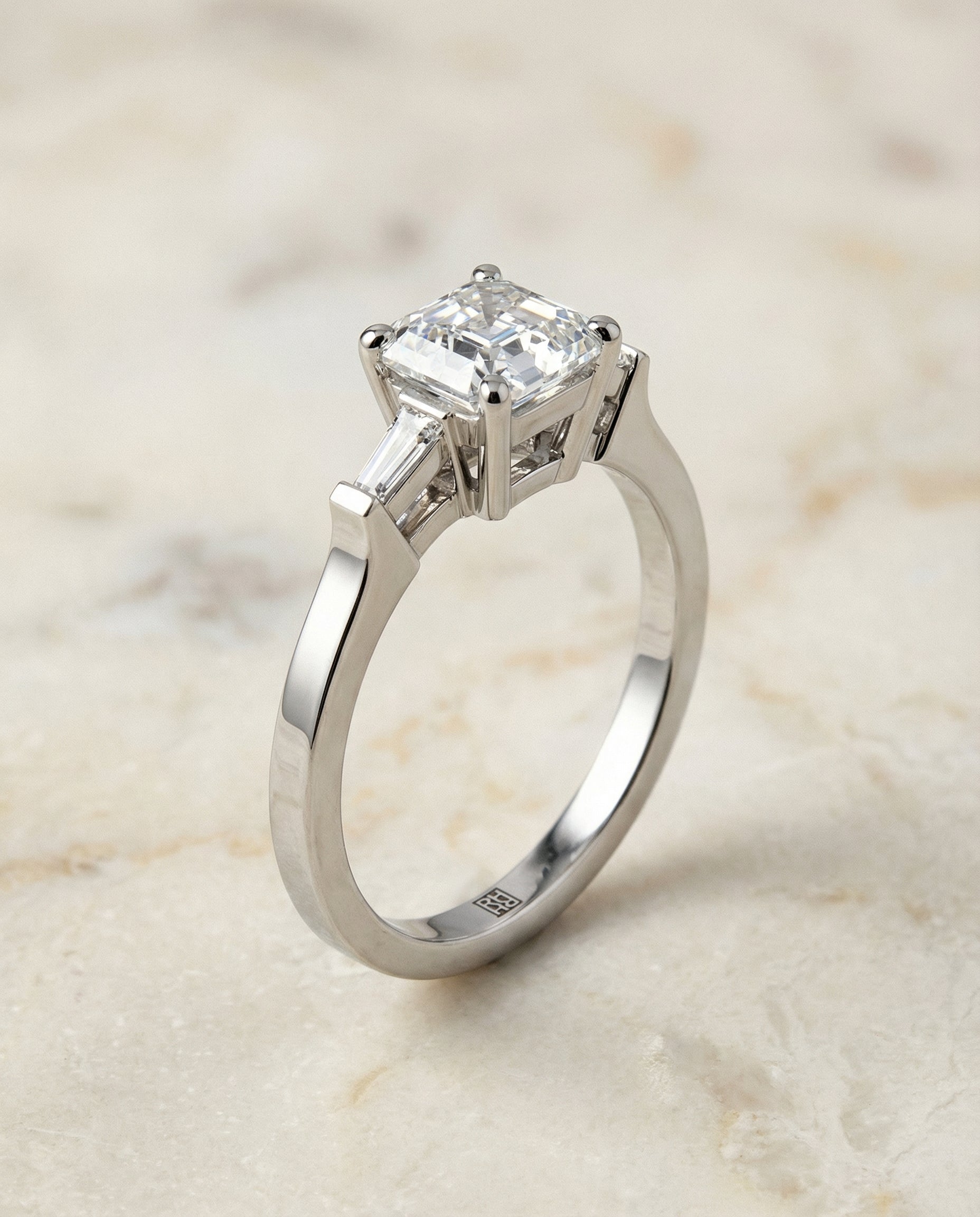 Tapered Baguette Three Stone Asscher, in Platinum, channel setting – front view | RockHer