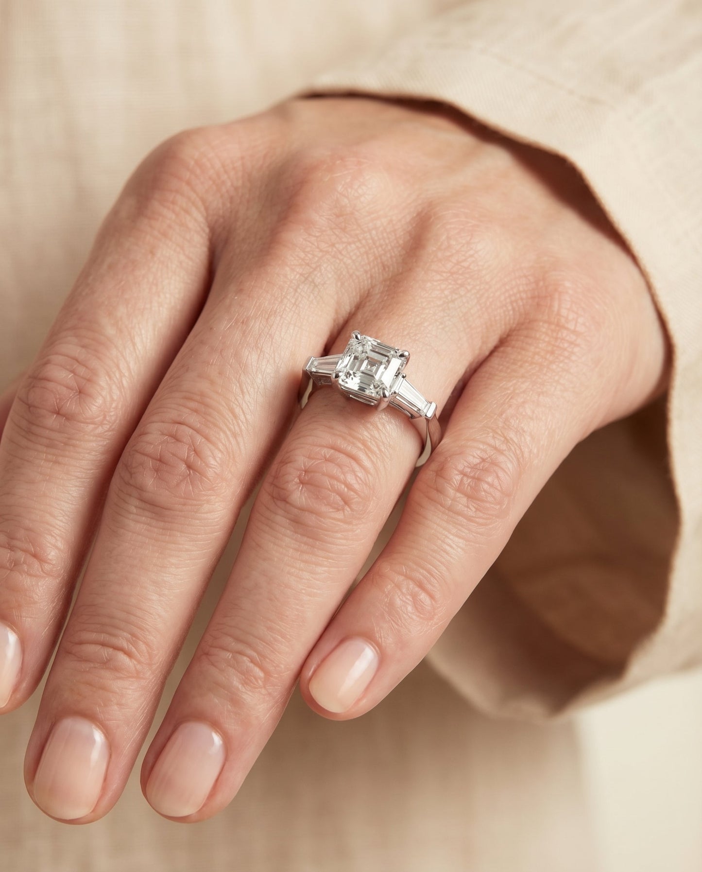 Tapered Baguette Three Stone Asscher, in Platinum, channel setting – lifestyle shot | RockHer