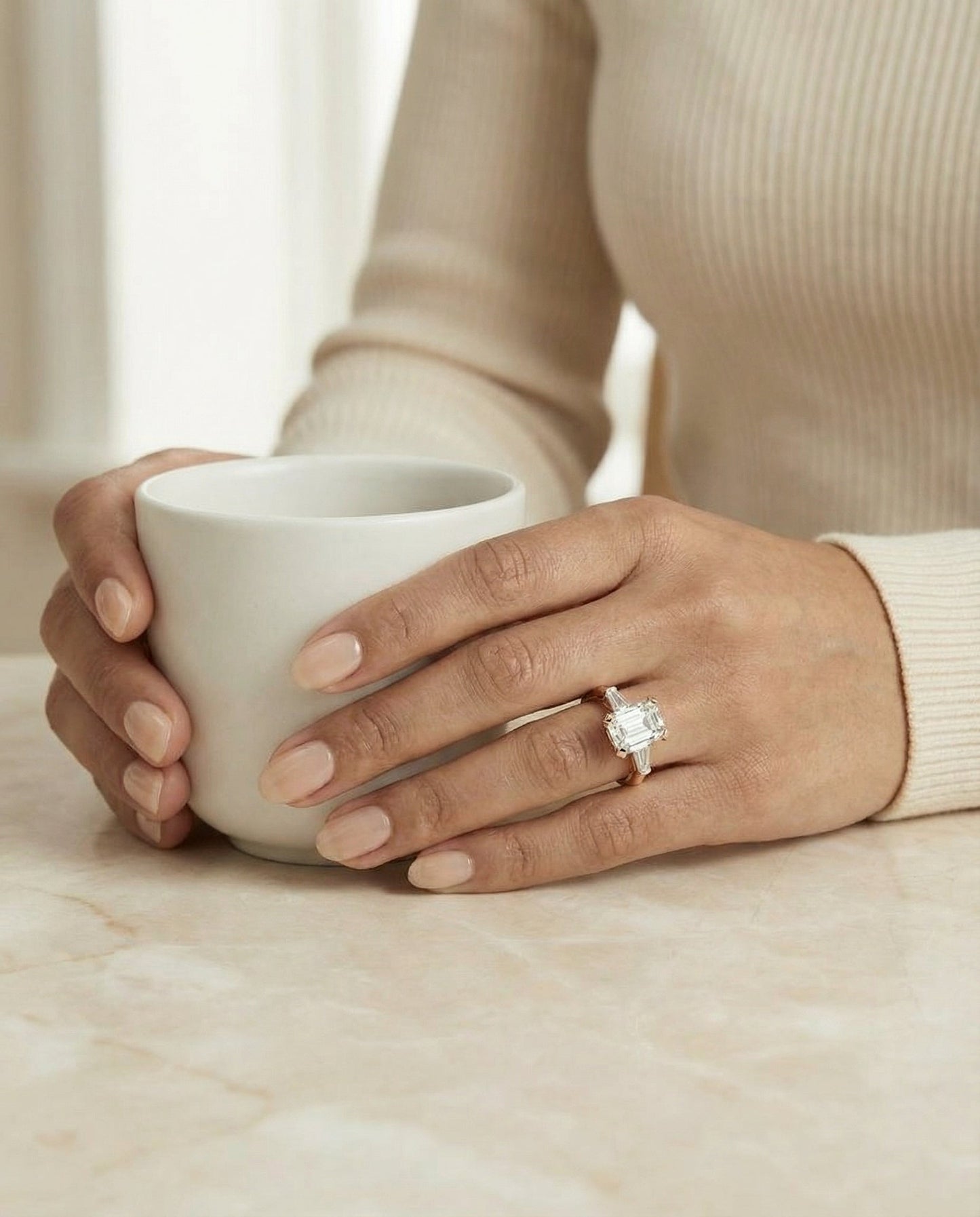 European Cut, Tapered Baguette Three Stone Emerald, in 14K Rose Gold, prong setting – lifestyle shot | RockHer