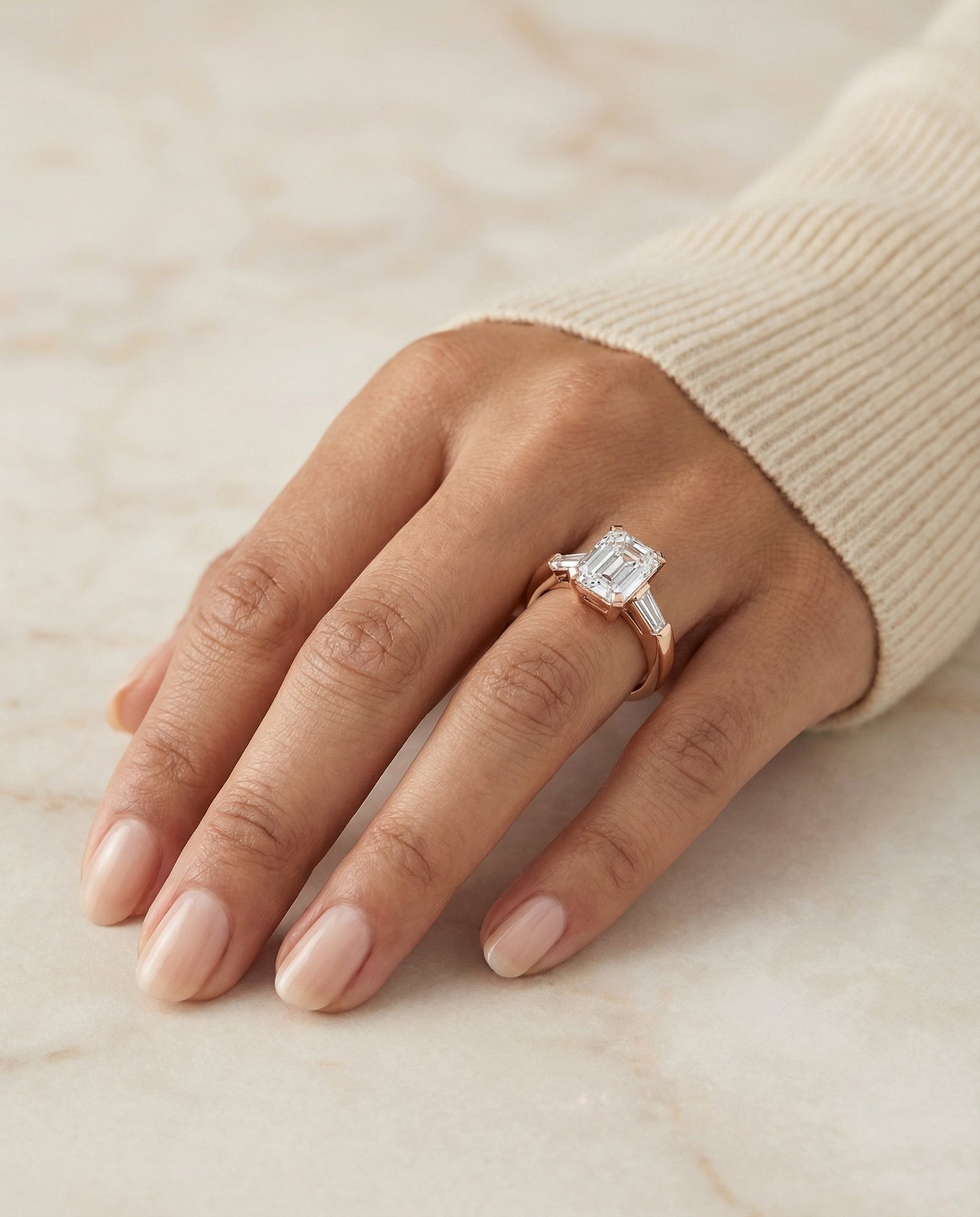 European Cut, Tapered Baguette Three Stone Emerald, in 14K Rose Gold, prong setting – lifestyle shot | RockHer
