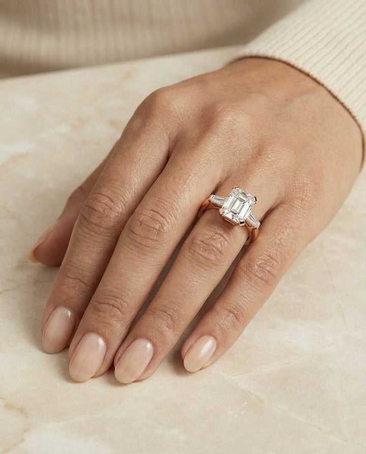 European Cut, Tapered Baguette Three Stone Emerald, in 14K Rose Gold, prong setting – lifestyle shot | RockHer