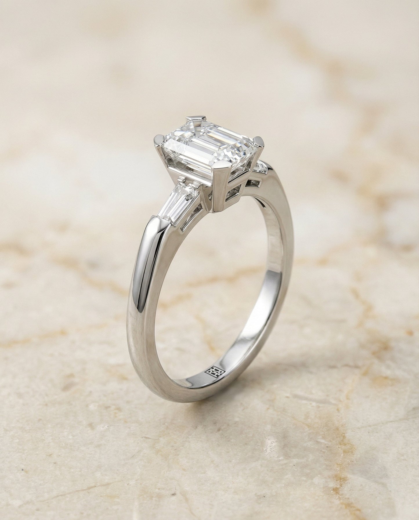 European Cut, Tapered Baguette Three Stone Emerald, in Platinum – front view | RockHer