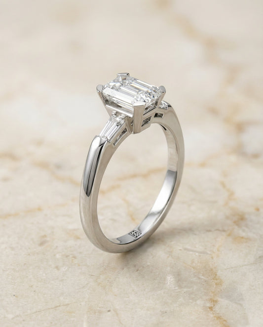 European Cut, Tapered Baguette Three Stone Emerald, in Platinum – front view | RockHer