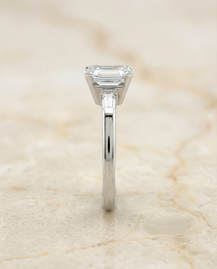 European Cut, Tapered Baguette Three Stone Emerald, in Platinum – side profile | RockHer