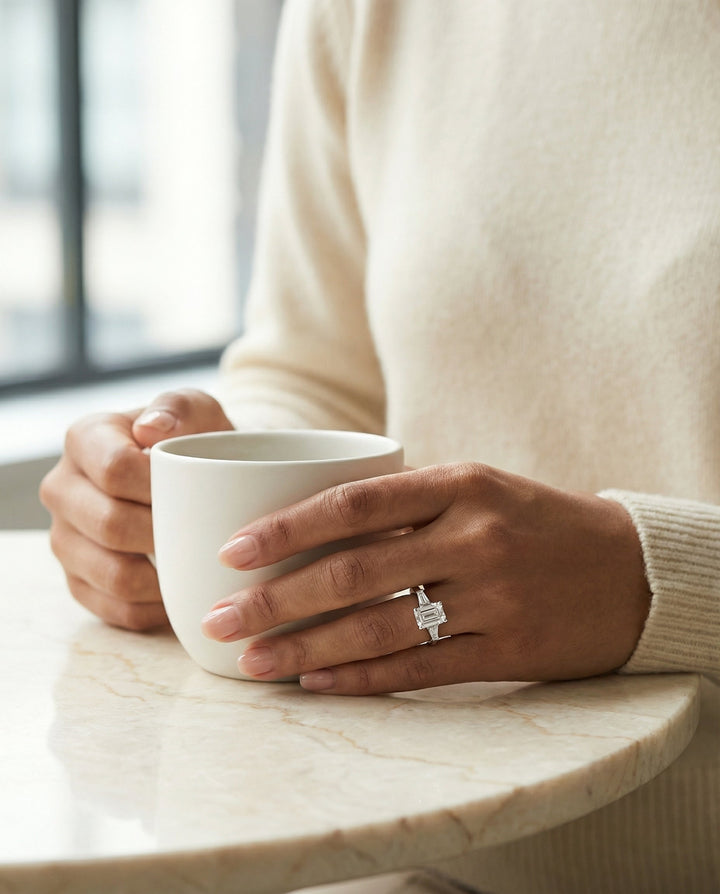 European Cut, Tapered Baguette Three Stone Emerald, in 18K White Gold, channel setting – lifestyle shot | RockHer