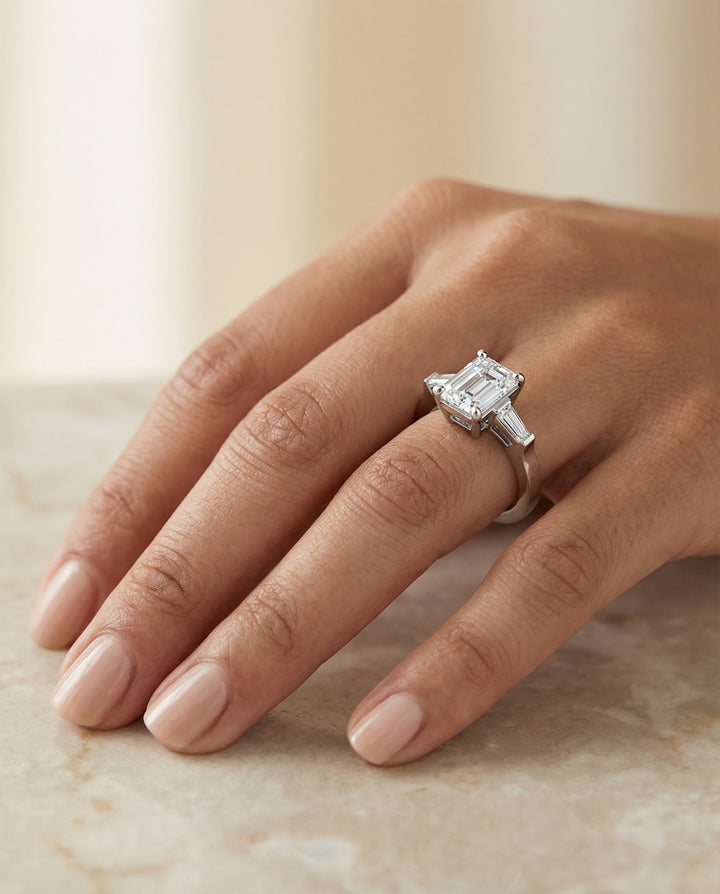 European Cut, Tapered Baguette Three Stone Emerald, in 18K White Gold, channel setting – lifestyle shot | RockHer