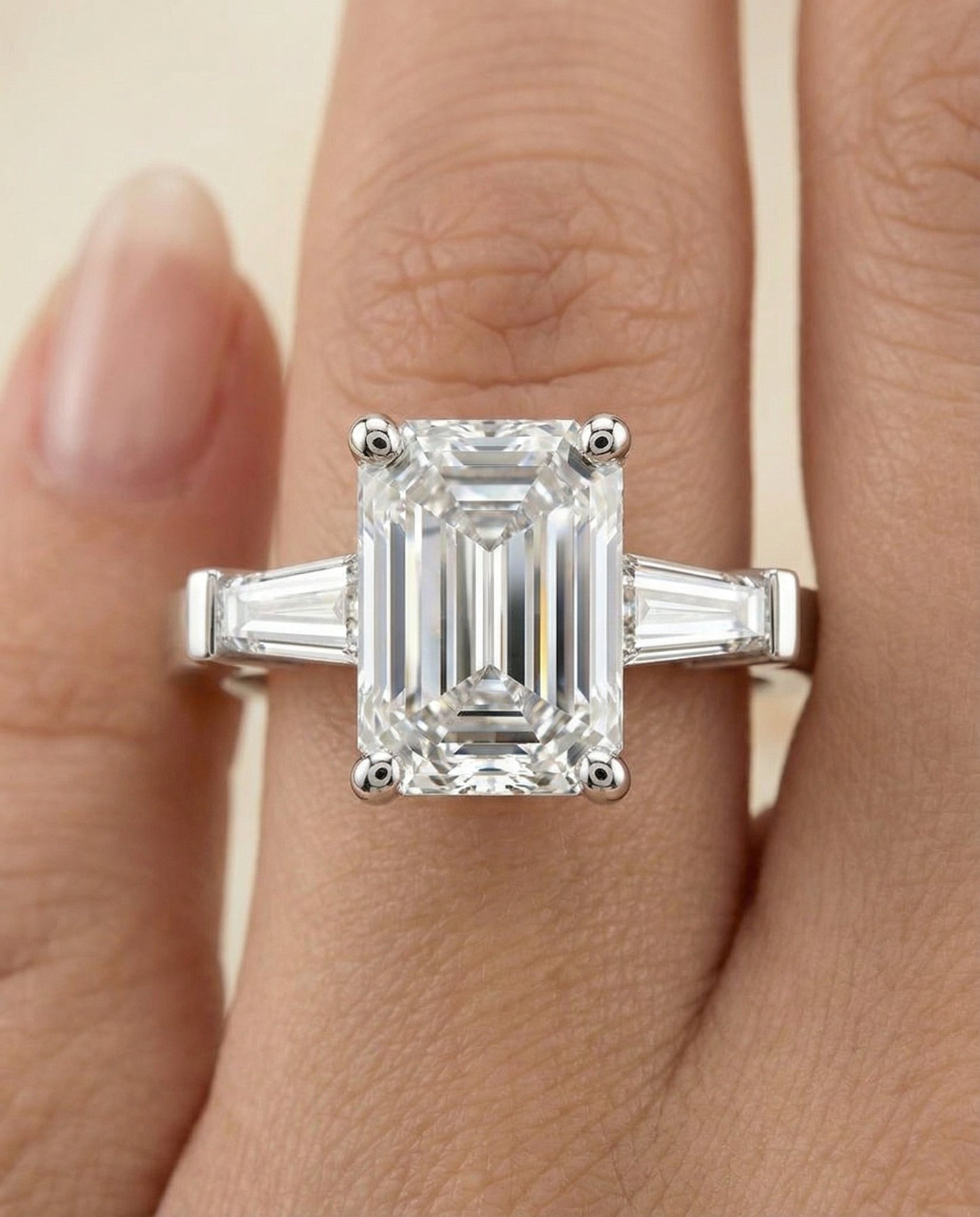 European Cut, Tapered Baguette Three Stone Emerald, in Platinum, channel setting – lifestyle shot | RockHer