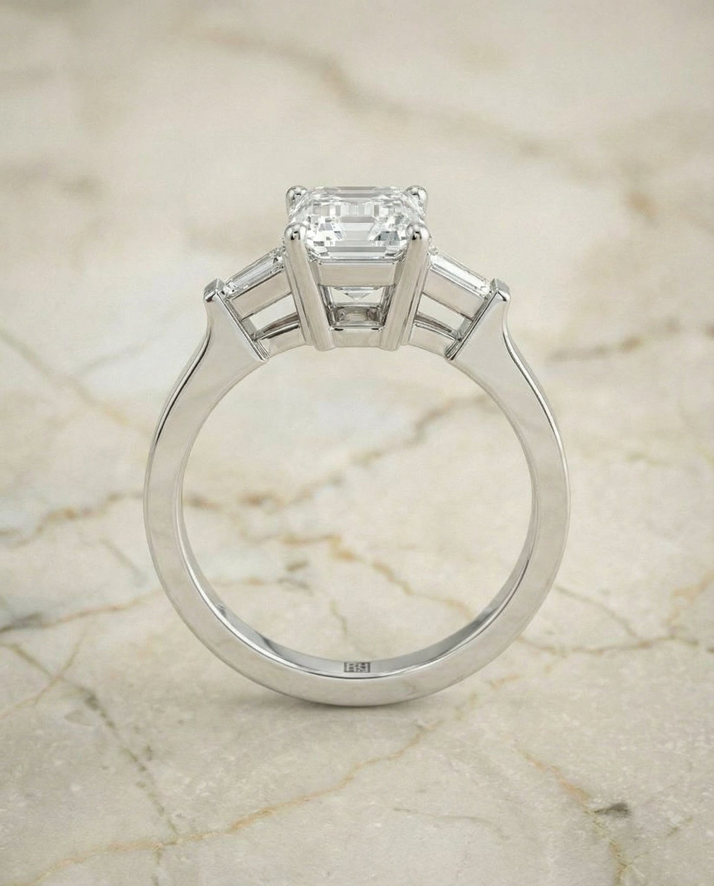 European Cut, Tapered Baguette Three Stone Emerald, in Platinum, channel setting – side profile | RockHer