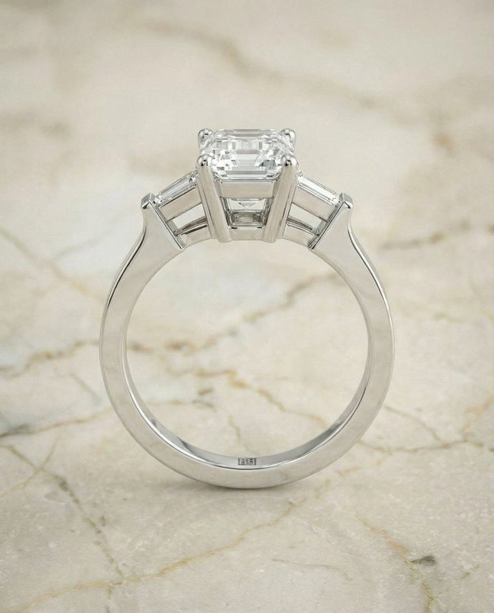 European Cut, Tapered Baguette Three Stone Emerald, in 18K White Gold, channel setting – side profile | RockHer