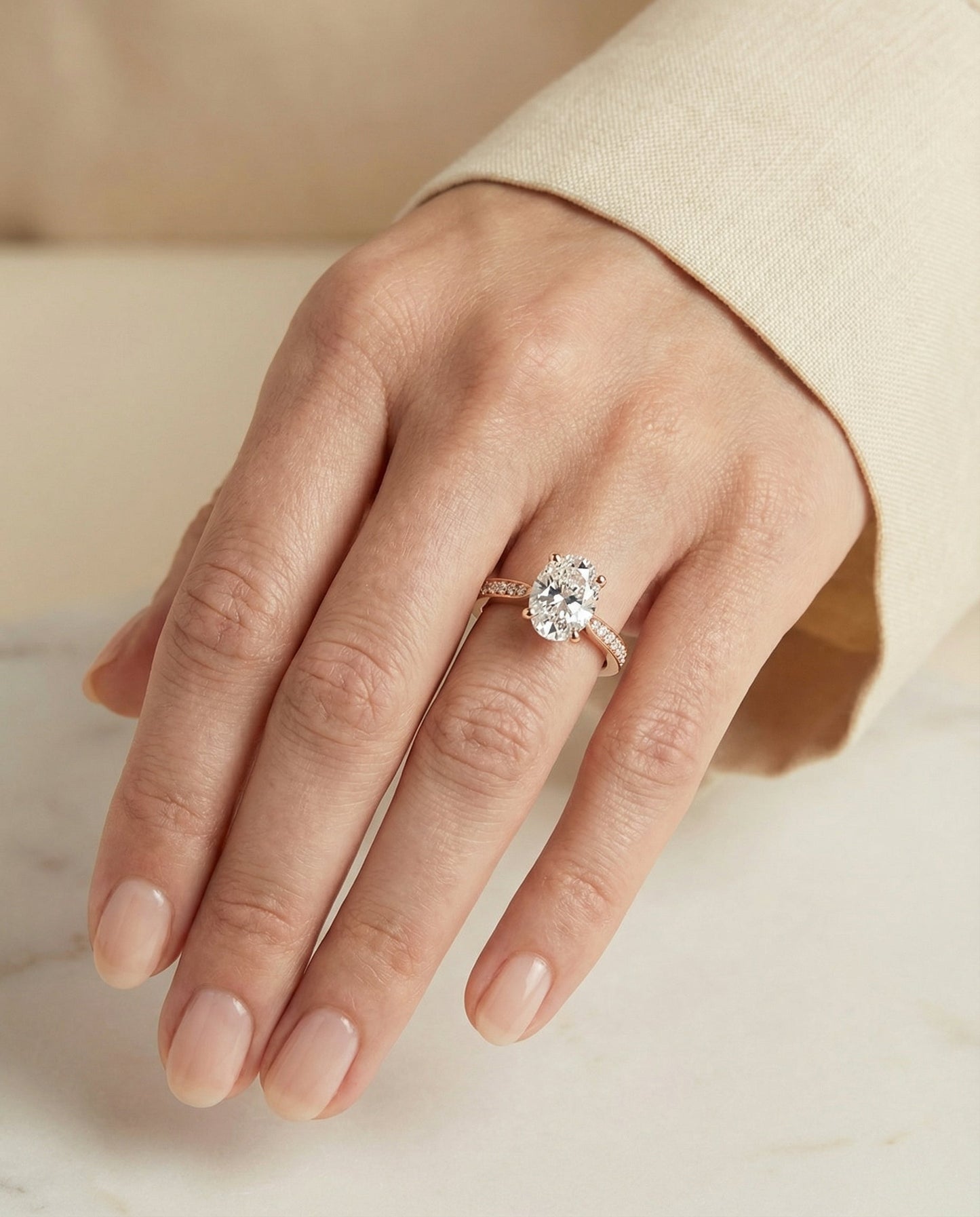 Carrie Select tapered pavé oval oval ring in 14K Rose Gold — on hand angled — RockHer