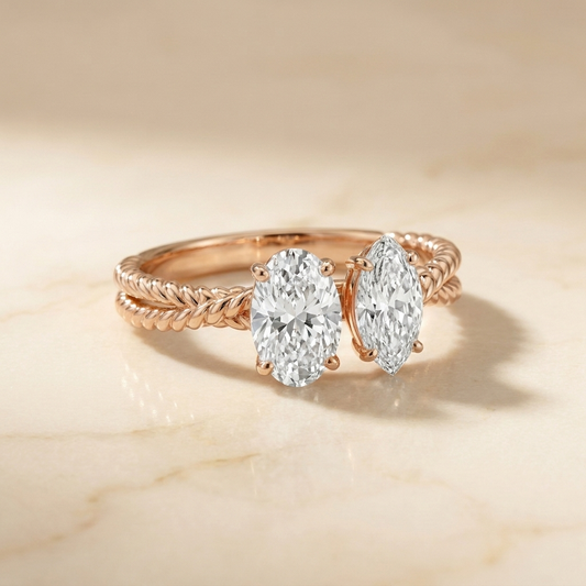 14K Rose Gold Taylor Select Toi et Moi Oval & Marquise Twisted Band Lab Diamond Engagement Ring - Hero on warm marble