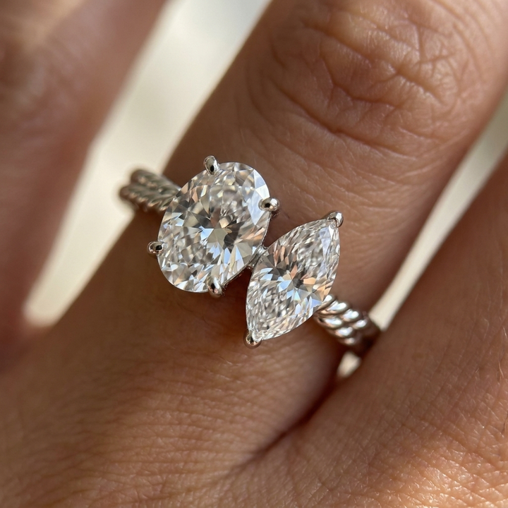 18K White Gold Taylor Select Toi et Moi Oval & Marquise Twisted Band Lab Diamond Engagement Ring - Macro close-up on finger