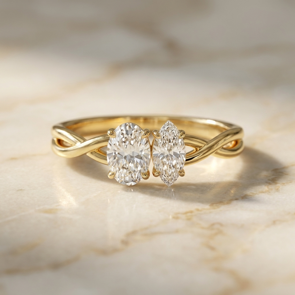18K Yellow Gold Taylor Select Toi et Moi Oval & Marquise Twisted Band Lab Diamond Engagement Ring - Hero on warm marble