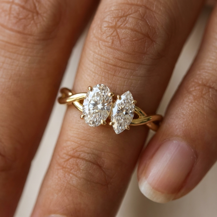 18K Yellow Gold Taylor Select Toi et Moi Oval & Marquise Twisted Band Lab Diamond Engagement Ring - Macro close-up on finger