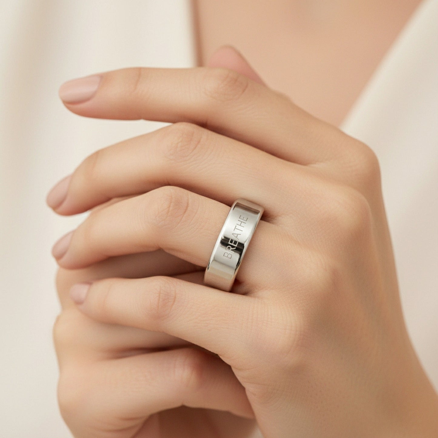 BREATHE engraved 14K White Gold Oura Ring cover worn on hand